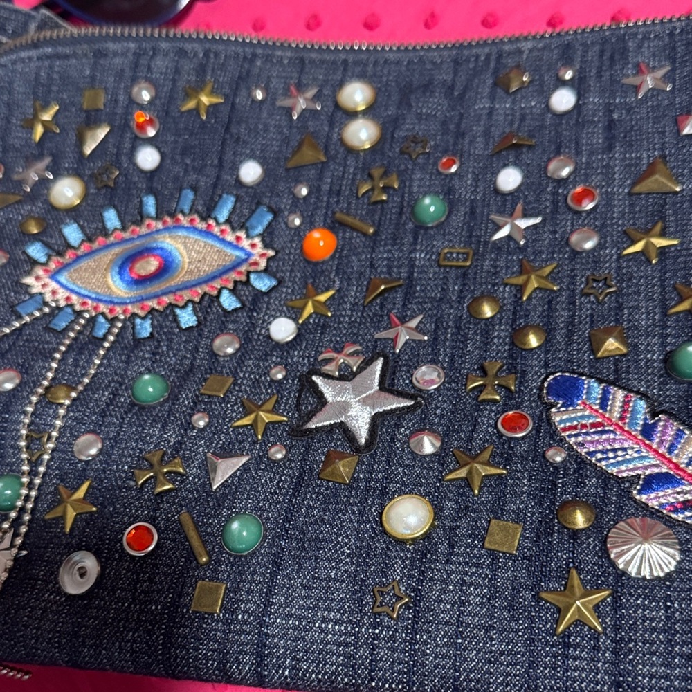 Embellished jeans Denim Clutch with Eye Motif from Steve Madden